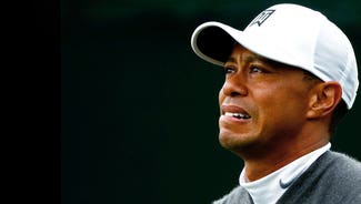 Next Story Image: Tiger Woods withdraws because of an apparent back injury